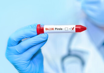 Fototapeta premium Doctor holding a test blood sample tube for the detection of the BA.2.86 Pirola on the blue background .New Covid 19 Pirola Variant
