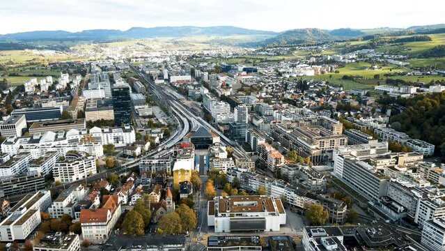 panoramic aerial perspective of Alpine lakeside city featuring the City of Zug and Alpine Lake and Swiss Architecture in the Alps of Switzerland 
