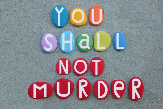 You shall not murder,  moral imperative included as one of the Ten Commandments in the Torah composed with colored stone letters over green sand for a unique banner or poster