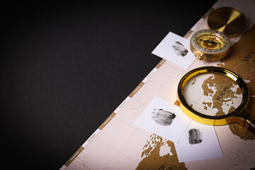 Magnifying glass with map and vintage compass