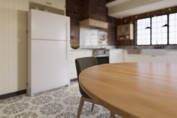 White kitchen with dark red brick, wood, large window and kitchen utensils. 