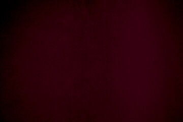 Gradient  dark red silk fabric texture used as background. red panne fabric background of soft and...
