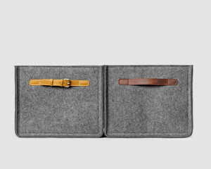Gray felt storage baskets with leather handles for organizing office space