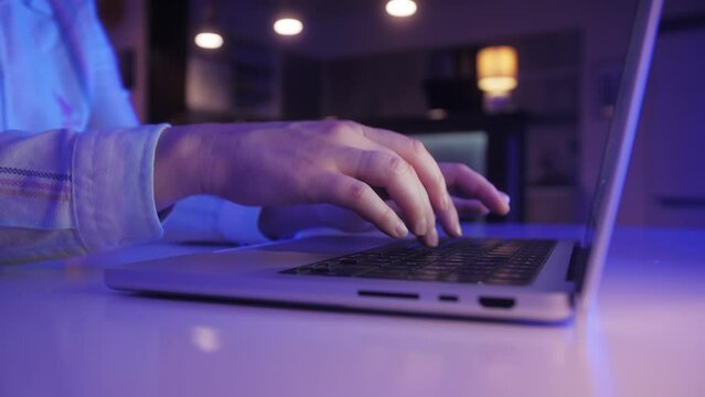 Hands type on laptop keyboard close up. Businesswoman sit at desk texting e-mail, correspond to client remotely.