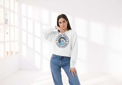 Mockup of young woman wearing customizable sweatshirt touching face
