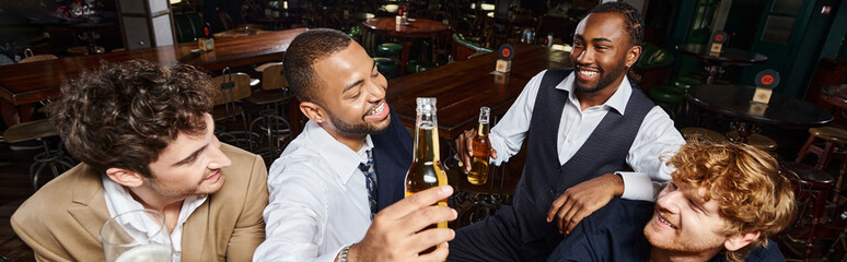 banner of happy colleagues in formal wear chatting and drinking beer, spending time after work