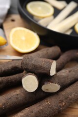 Raw salsify roots on table, closeup view