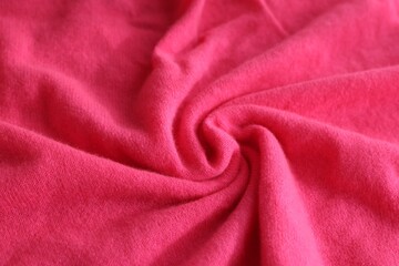 Beautiful pink fabric as background, closeup view