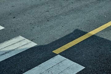Fototapeta premium Close up Crossroad and Yellow Line on Asphalt Road Background.