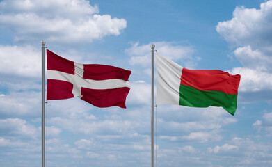 Madagascar and Denmark flags, country relationship concept