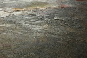 Texture of grey stone surface as background, closeup