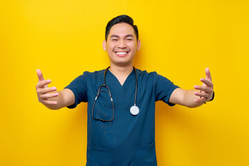 Professional young Asian male doctor or nurse wearing a blue uniform giving a hug to a patient isolated on yellow background. Healthcare medicine concept - Powered by Adobe