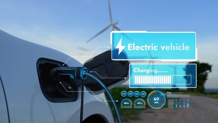 Electric car recharging energy from EV charging station display futuristic smart battery status hologram by EV charger plug cable in wind turbine farm. Alternative clean energy sustainability. Peruse