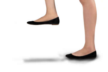 Digital png photo of caucasian female legs wearing black shoes on transparent background