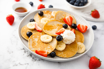 Homemade pancakes with banana and berries
