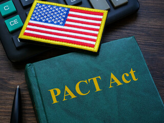The Promise to Address Comprehensive Toxics PACT Act on the desk.