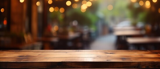 Blurry background of a coffee shop with a wooden table in focus perfect for showcasing a product