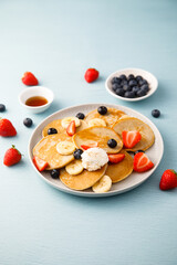 Homemade pancakes with banana and berries