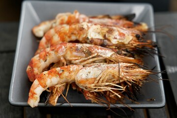 some food is on a tray by the plate and fork