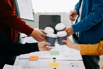  UX developer and ui designer brainstorming about mobile app interface wireframe design with...