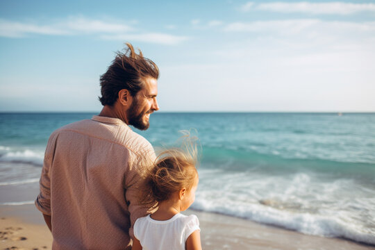 Shot of a young man spending time at the beach with his adorable daughter