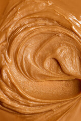 Close-up of texture of melted, salted caramel with swirls. Delicious, sweet dressings for desserts or topping for drinks. Concept of food, breakfast, snacks, organic, homemade products