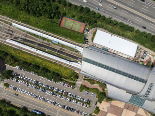 Monorail train on the railroad tracks in the city, aerial view