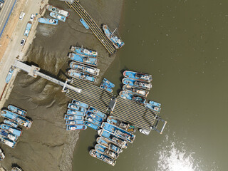 Aerial view of fishing boats by the shore