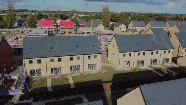 Drone 50fps. New build houses. Affordable housing development, construction site, new modern family houses. Filmed. Northern England. UK.