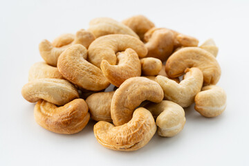 Dried cashew nuts. Macro shot. Raw snack. Pile cashew nuts without shell. Whole nut kernels	