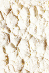 Close-up of delicious, sweet, organic cream with textured waves. Sweet cream for cakes and desserts. Concept of food, breakfast, healthy eating and snacks, organic, homemade products