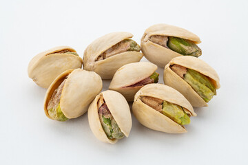 Salted Pistachios for Beer, Macro, Spin. Isolated Background of a Beer Snack of Salted Pistachio Nuts. Healthy Delicious Pistachios. Salted roasted pistachio macro	