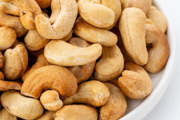 Dried cashew nuts. Macro shot. Raw snack. Pile cashew nuts without shell. Whole nut kernels	
