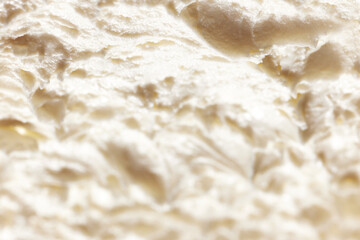 Close-up image of melted ice-cream. Vanilla natural ice cream texture. Concept of food, breakfast, healthy eating and snacks, organic, homemade products