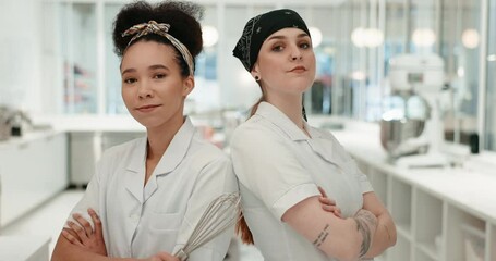 Team, chef and women with arms crossed in kitchen at restaurant for hotel service. Portrait, cooking and collaboration with culinary professional and employee for catering career or competition