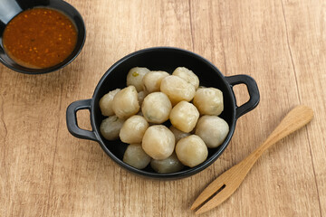 Cilok, traditional food from West Java, Indonesia, made from tapioca, chewy textured. Served with peanut sauce. 
