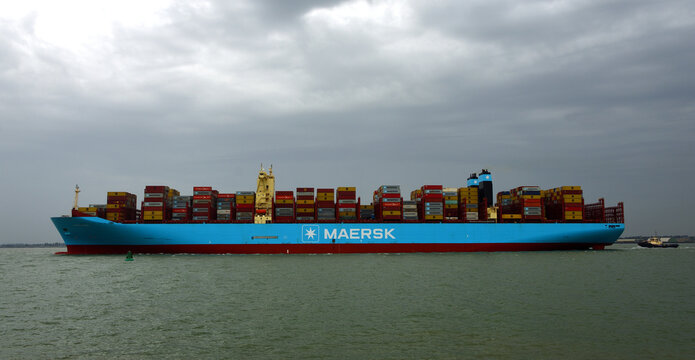 Container Ship "Marie Maersk" leaving the port of Felixstowe dark sky. 