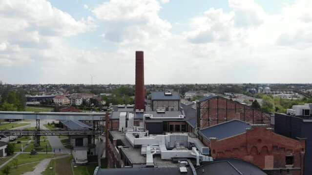 Aerial shot of the Żnin Arche Hotel inside old sugar factory in Poland. Boom up shot.