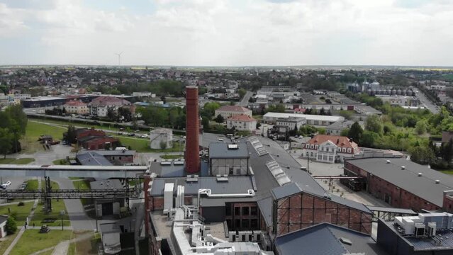 Aerial shot of the Żnin Arche Hotel inside old sugar factory in Poland. Jib and tilt-down shot.