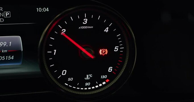 Modern car tachometer or rev counter. Revving up a diesel engine. Close up shot, real time, no people