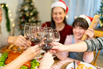 Merry Christmas and Happy New Year 2024!Multiracial young creative family are celebrating holiday.