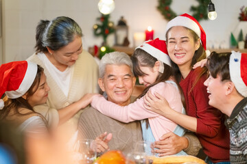 Merry Christmas and Happy New Year 2024!Multiracial young creative family are celebrating holiday.