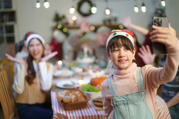 Merry Christmas and Happy New Year 2024!Multiracial young creative family are celebrating holiday.