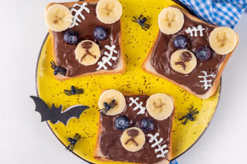 Funny Halloween bear toasts with nuts butter