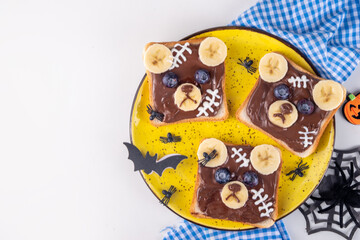 Funny Halloween bear toasts with nuts butter