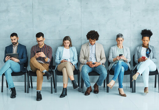 man business chair sitting waiting woman businessman candidate recruitment businesswoman office smartphone phone tablet using connected network job young interview