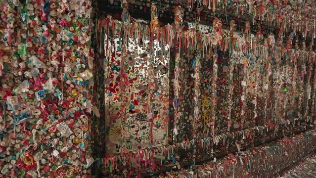 The Gum Wall - a Brick Wall Covered in Used Chewing Gum under Pike Place Market in Downtown Seattle, Washington, United States