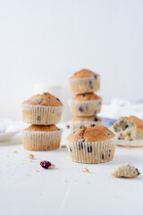 Blueberry muffins in a baking dish. Cupcakes with berries on a white background.