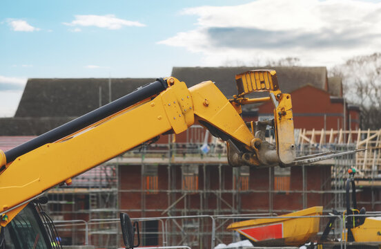 Telehandler moving materials around building site in safe maner