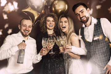 Group of elegantly dressed people celebrating a holiday or event, drinking sparkling wine